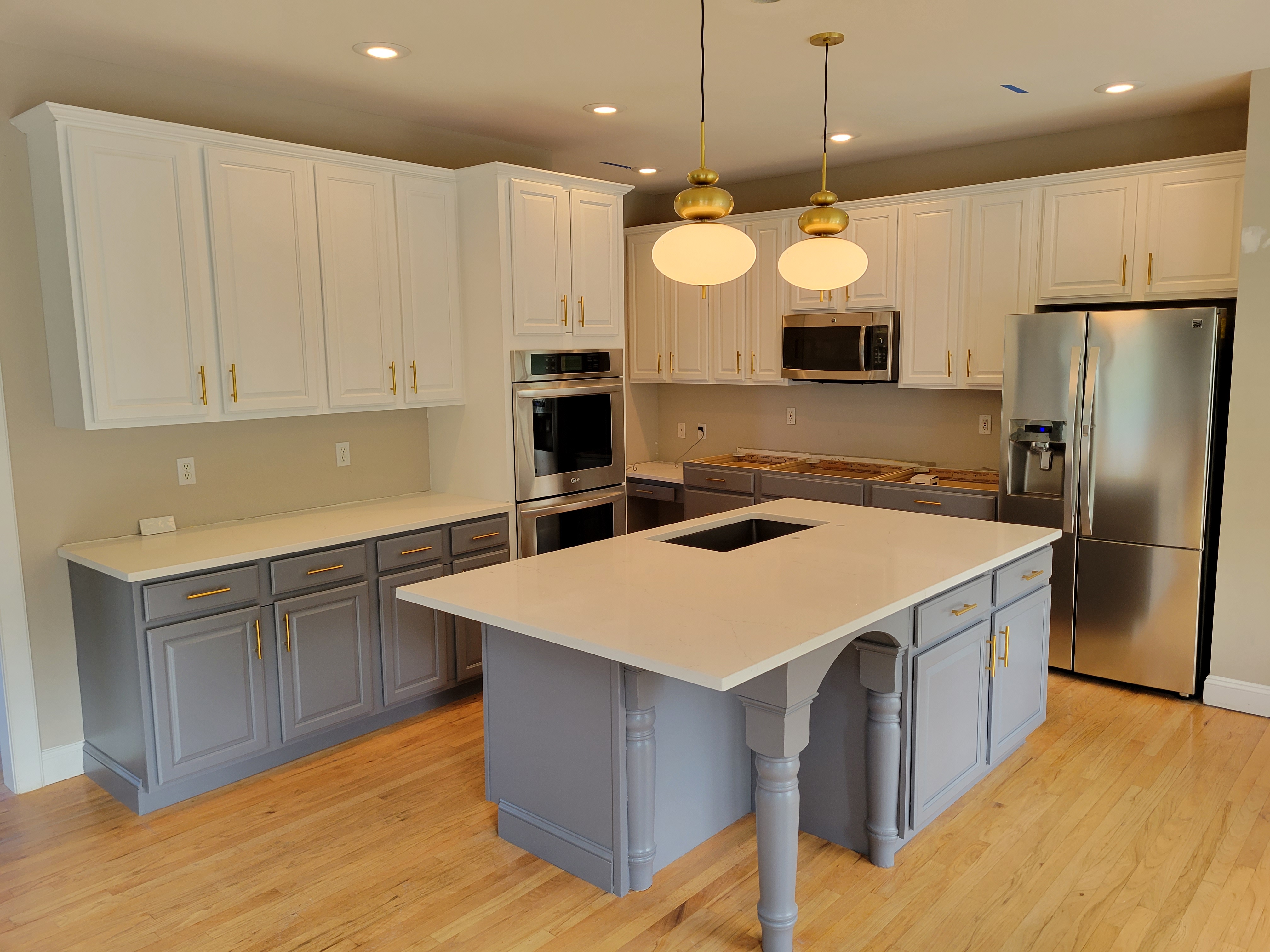 Professional cabinet painting and kitchen remodeling in Scranton PA - two-tone white and gray cabinets